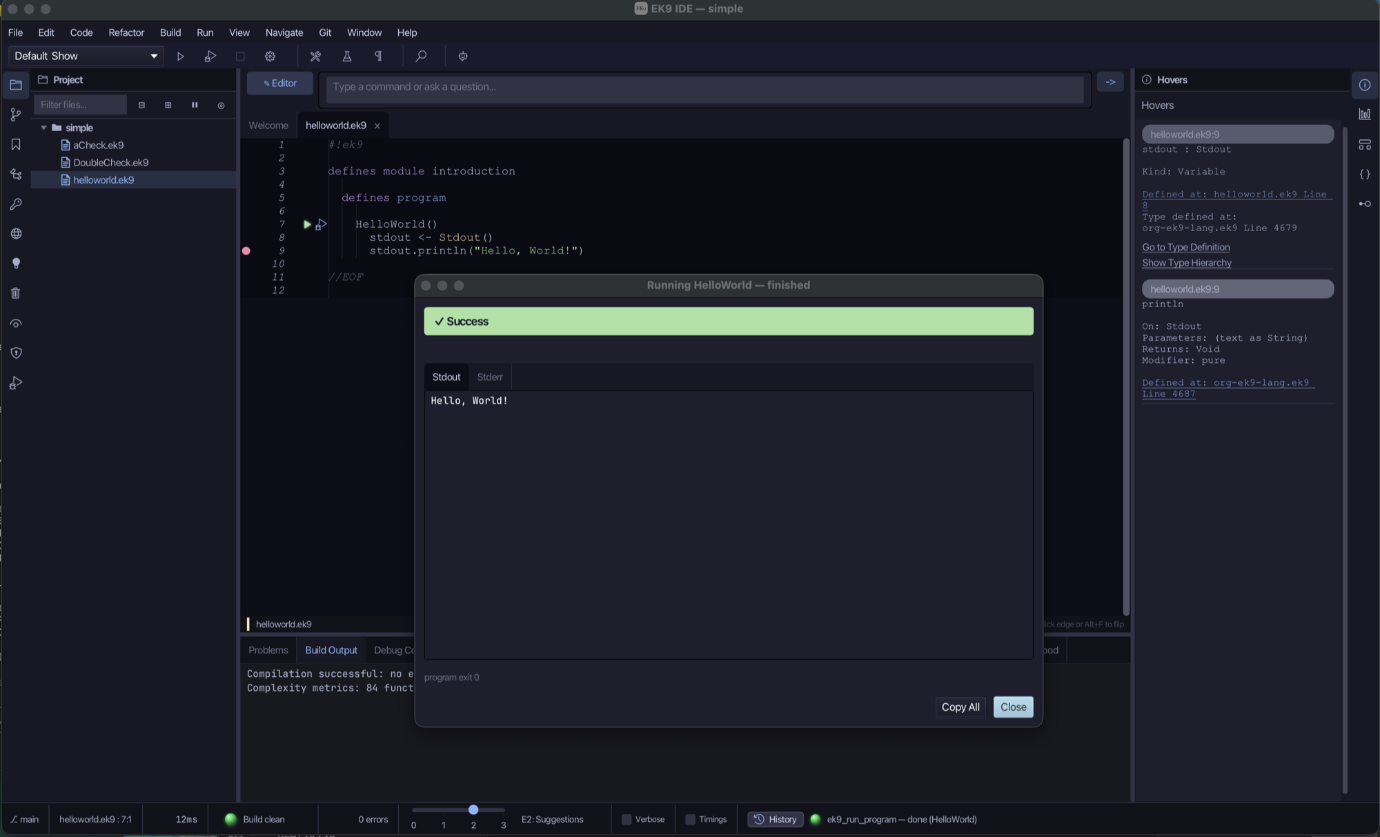 The EK9 IDE with helloworld.ek9 open: two hovers on the right describe stdout and println, and the run dialog shows Success with the output Hello, World!